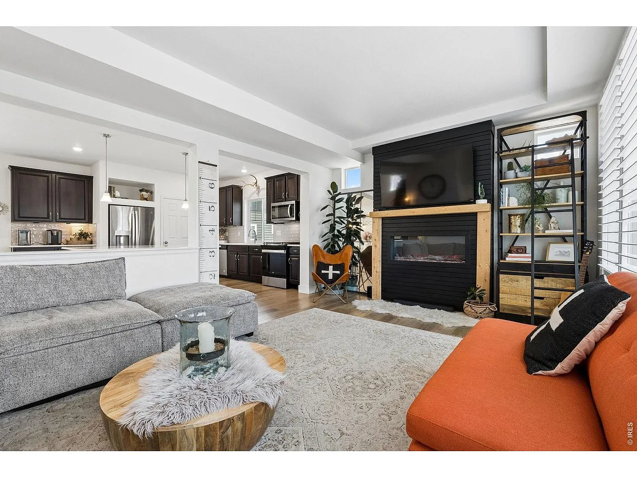 Living room with a black shiplap fireplace feature wall