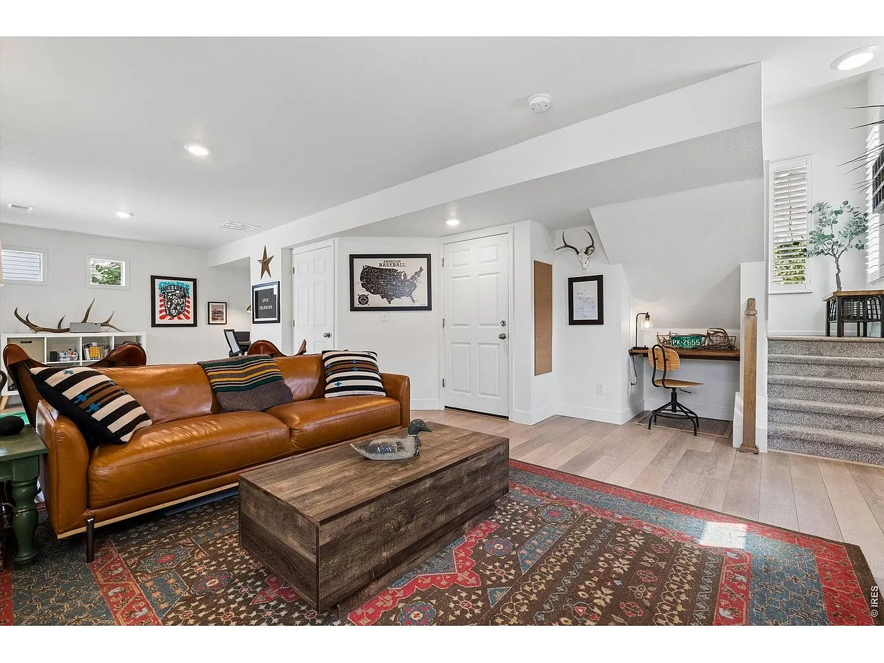 Rec room corner with built-in desk nook and walkout door